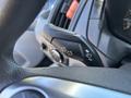 Close-up of the turn signal lever on a 2016 Ford Transit 150 steering column showing left and right turn indicators