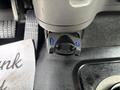 A close-up of a Prodigy P3 electronic brake control mounted inside a 2013 Freightliner 114SD with a digital display showing the brake setting