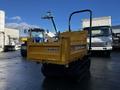 A yellow 2013 Yanmar C12R-B tracked dumper with a flatbed surface and a manual handle at the rear