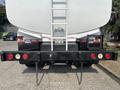 2010 Freightliner M2 106 featuring a rear view with a ladder attachment and rear lights in a black and red color scheme