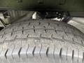 Close-up of a treaded tire from a 2020 Ford Transit 250 showing detailed grooves and wear on the rubber surface