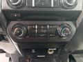 Dashboard controls of a 2017 Ford F-150 featuring climate control knobs and buttons for heating and air conditioning