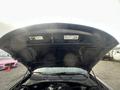 A 2015 Dodge Charger with its hood opened revealing the engine compartment