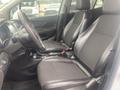 Interior view of a 2018 Buick Encore showing two black leather front seats and a steering wheel