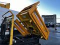 A yellow Yanmar C12R-B construction machine with a raised dump bed positioned at an angle