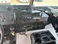 The dashboard of a 2011 Workhorse W62 featuring controls gauges switches and a radio with visible keys on the ignition panel