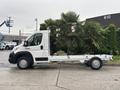 2023 RAM Promaster 3500 white chassis cab with an empty cargo area and minimalistic design