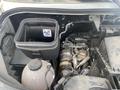 2024 Mercedes-Benz Sprinter engine compartment showing a black container and visible components like pipes and an engine part