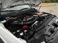 The image shows the engine bay of a 2018 Ford F-550 featuring a large black air intake and various engine components visible