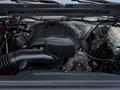 A 2017 GMC Sierra 3500HD engine with visible components including an air intake and alternator in a well-organized engine bay