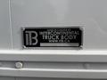 A black metal plate with the text "ITB MADE IN CANADA BY INTERCONTINENTAL TRUCK BODY WWW.ITB.CA" and a number "6346"