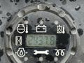 The control panel of a 2009 John Deere 2653B Precision Diesel Mower displaying a digital readout of 2437.6 and various icons for functions and indicators