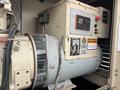A Katolight SED60FPJ4 generator with a control panel featuring various buttons and indicators alongside a large motor assembly