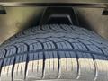 Close-up of a tire from a 2015 RAM 1500 showcasing the tread pattern and rubber texture