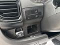 The control panel of a 2023 RAM Promaster 3500 featuring various buttons for lights and settings along with a small storage compartment