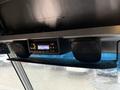 A dashboard stereo system with speakers designed for a 2018 Ford E-450 featuring a digital display and control panel
