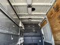 Interior of a 2010 Mercedes-Benz Sprinter van featuring storage compartments and cabinets along the walls