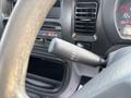 Close-up of the windshield wiper control lever in a 2010 Daihatsu Hijet featuring various settings including mist off intermittent low and high