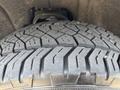 A close-up of the tire tread on a 2017 Chevrolet Silverado 1500 highlighting the detailed patterns and grooves of the rubber tire