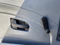 Interior door handle and window crank of a 2011 International 4300 truck in gray plastic