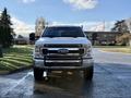 A 2020 Ford F-350 pickup truck is seen from the front showcasing its chrome grille and prominent headlights