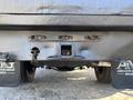 The rear view of a 2014 RAM 5500 showing the hitch receiver and mounting points with mud flaps visible on either side