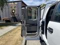 A 2019 Ford F-150 with the driver's side door open showcasing the interior features and seating