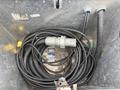 A 2005 Katolight SED60FPJ4 generator with a coiled electrical cable and connectors positioned inside a metallic box