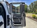 A 2019 Ford F-150 with the driver's side door open revealing the interior features including the seat and door panel
