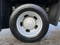 2021 RAM 5500 tire with a silver wheel rim and black rubber tread visible from a side angle