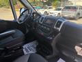 Interior of a 2020 RAM ProMaster 3500 featuring a steering wheel dashboard central console and seating area designed for cargo and utility use
