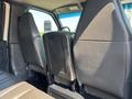 Interior view of a 2005 GMC C7500 Topkick showing the back of two front seats and the space between them