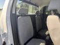 Interior view of the backseat of a 2017 Chevrolet Colorado with two gray fabric seats and headrests visible