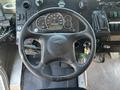A black steering wheel with the logo of Workhorse and various gauges and controls visible on the dashboard of a 2008 Workhorse W62