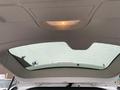 The interior view of a 2014 RAM Cargo Van showing the ceiling and a large rear window with a light overhead