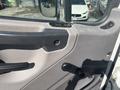 Close-up of the interior door panel of a 2022 Freightliner M2 106 featuring controls for windows and locks