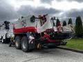 A red and white 2020 Pottinger Impress machine with large wheels and a compact design used for agricultural purposes