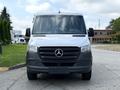 A 2021 Mercedes-Benz Sprinter van with a white exterior and a black front bumper facing forward