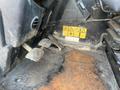Close-up of the foot pedals and floor of a 2013 JCB 510-56 Loadall displaying caution labels and signs of wear on the surface