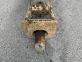 A rusty metal hitch attachment from a 2018 John Deere 350 with a cylindrical post and a flat rectangular base featuring mounting holes