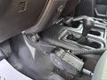 Close-up of the gear shifter and control panel in a 2013 RAM 5500 truck interior showcasing the shift lever and surrounding console features