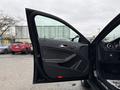 The image shows the open door of a 2016 Mercedes-Benz GLA-250 featuring a sleek interior design and control panel elements