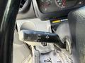 The image shows the control stalk of a 2014 Hino 195 featuring buttons for headlights and turn signals labeled with symbols for easy identification