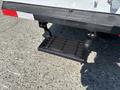 A black hitch step attached to the rear of a 2017 Ford F-550 truck designed for easy access to the truck bed