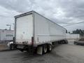 A 2010 Great Dane 45-foot freight trailer with a white exterior and dual axles parked at a facility