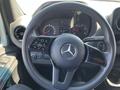 Interior view of a 2022 Mercedes-Benz Sprinter showing the steering wheel and dashboard with various gauges and controls