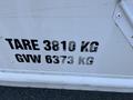 2012 Ford Econoline with visible TARE and GVW weight labels showing TARE 3810 KG and GVW 6373 KG