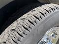 Close-up of a tire from a 2019 GMC Savana showing detailed tread pattern and wear on the rubber surface