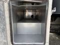 Interior storage compartment of a 2016 RAM 5500 with a metal finish and no contents visible