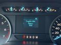 Dashboard display of a 2018 Ford F-150 showing engine idle hours at 968 along with various warning lights and gauges for temperature and fuel levels